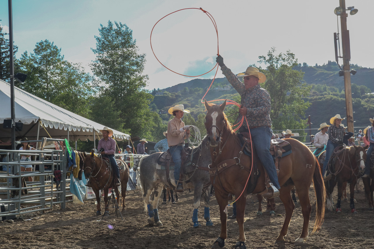 Photo of man on horse spinning a lasso