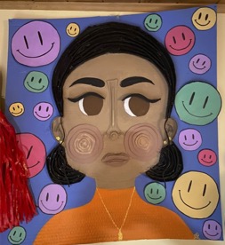A self portrait if a person with smiley faces around them.