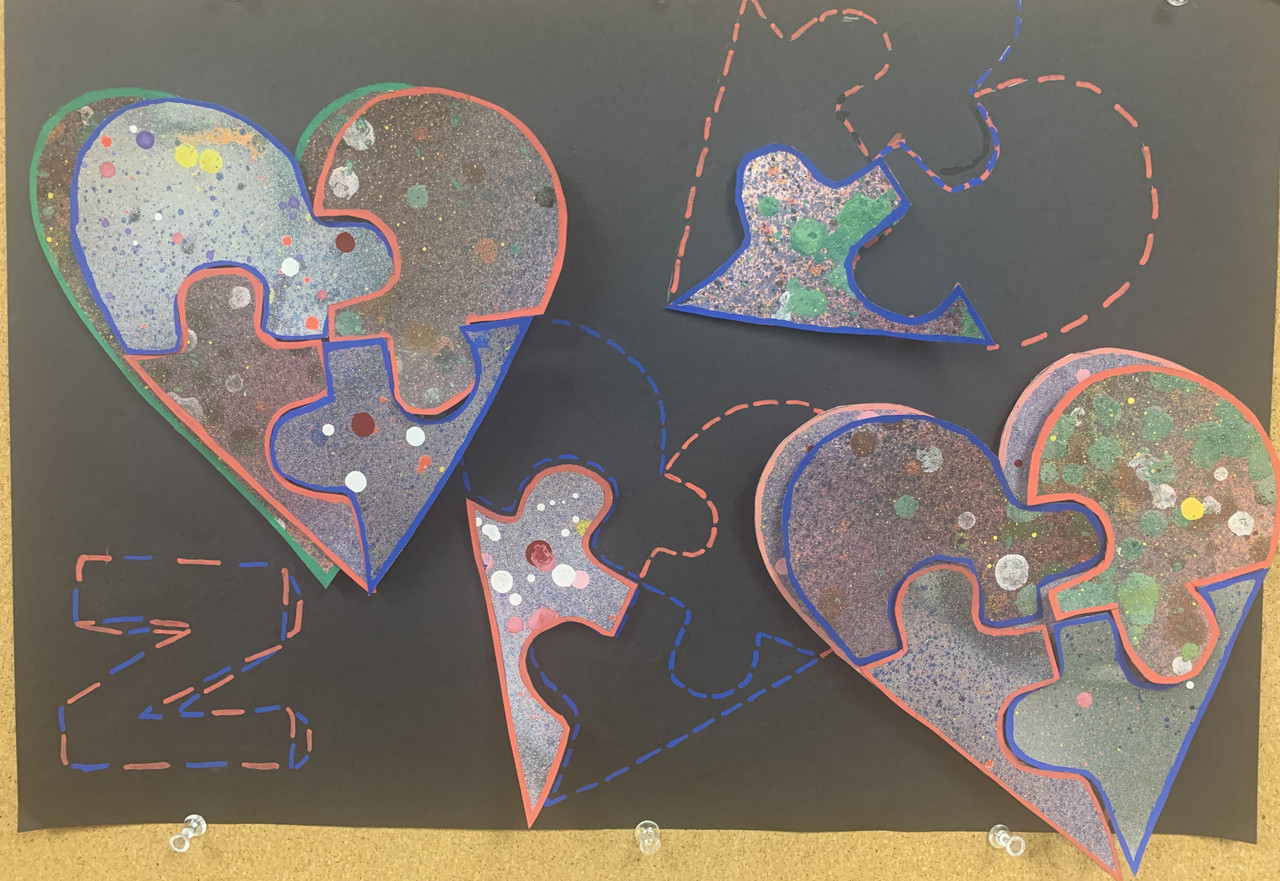 Collage piece of a puzzle heart against a black background.