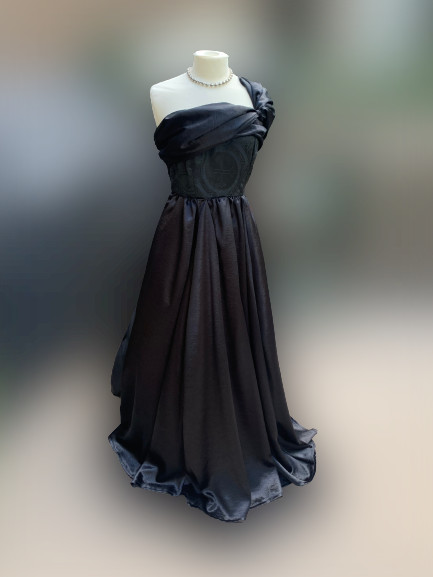 A black dress on a dress figure.