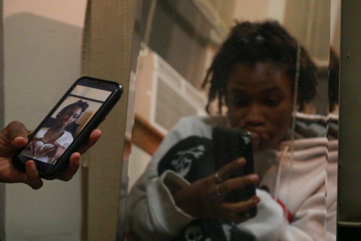 Phone and face with mirror.