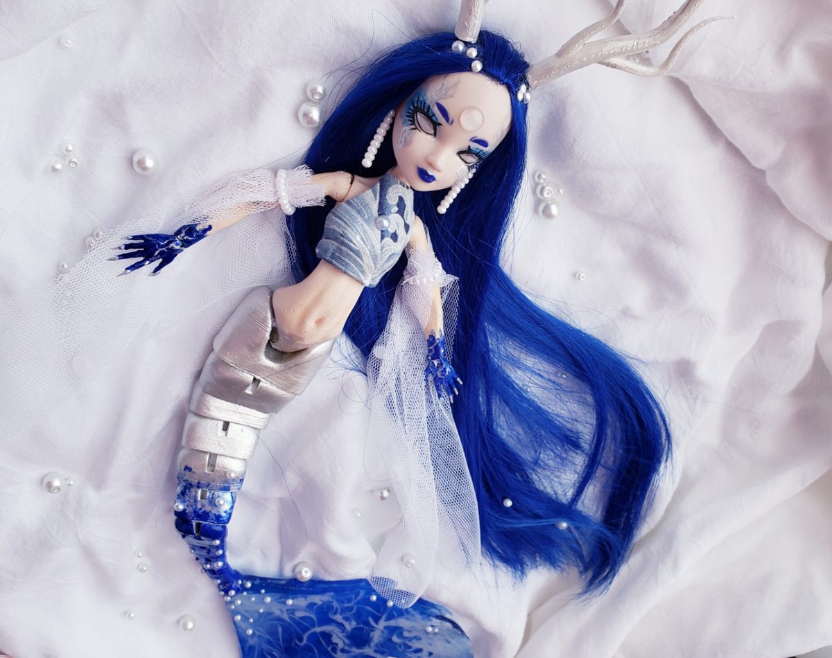 repurposed 3D doll with added sculptural elements
