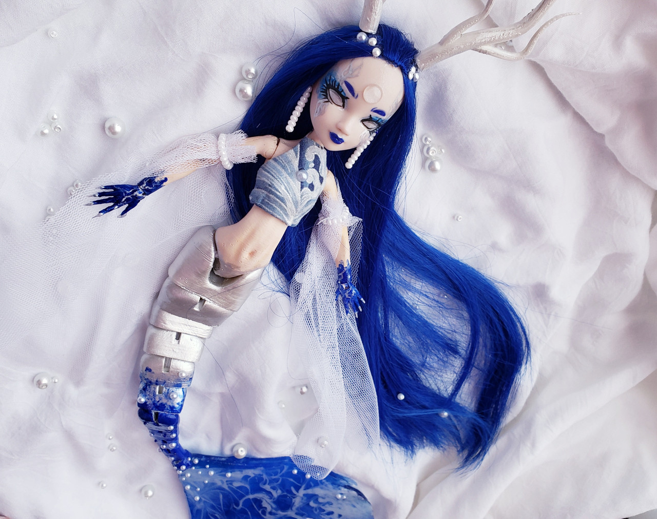 repurposed 3D doll with added sculptural elements