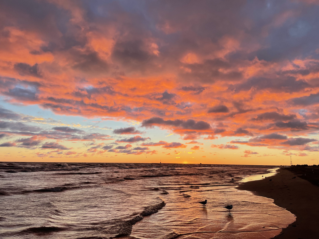 Lake with orange clouds.