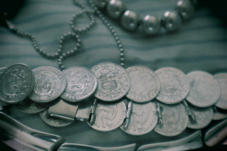Various pieces of silver metal on a striped sheet
