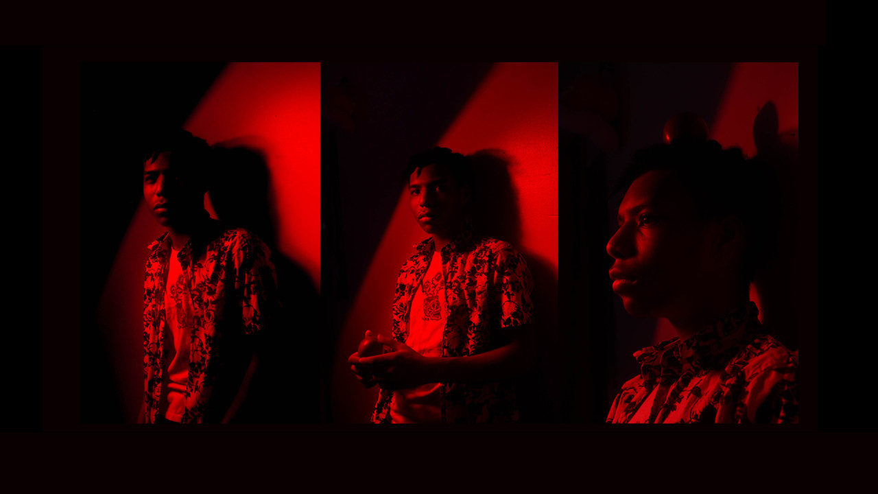 series of 3 photos of a person with red lighting