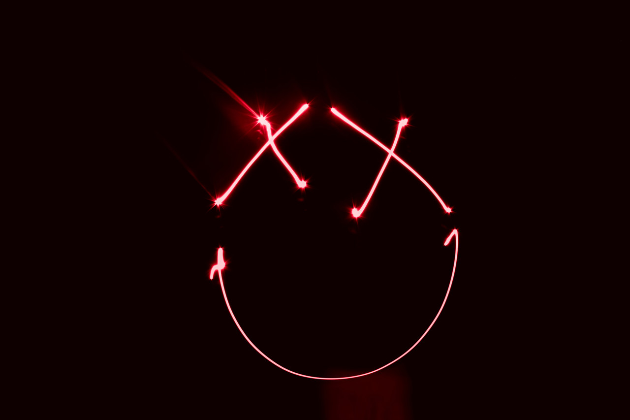 Neon smiley face on a black background