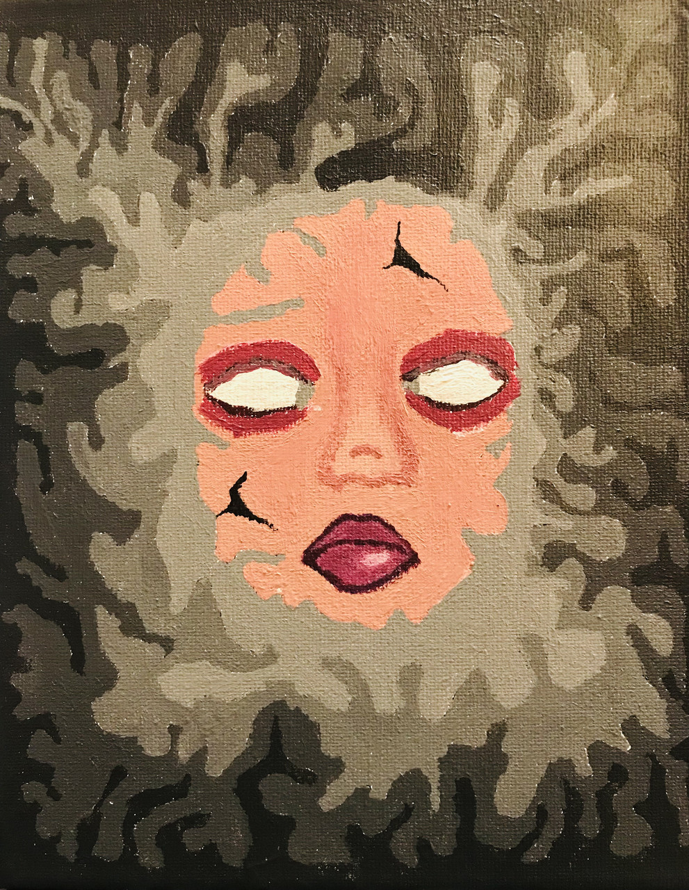 Face drawn on a patterned background