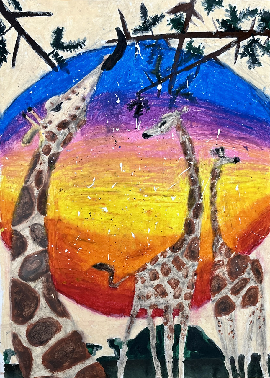 Giraffes in front of a sunset