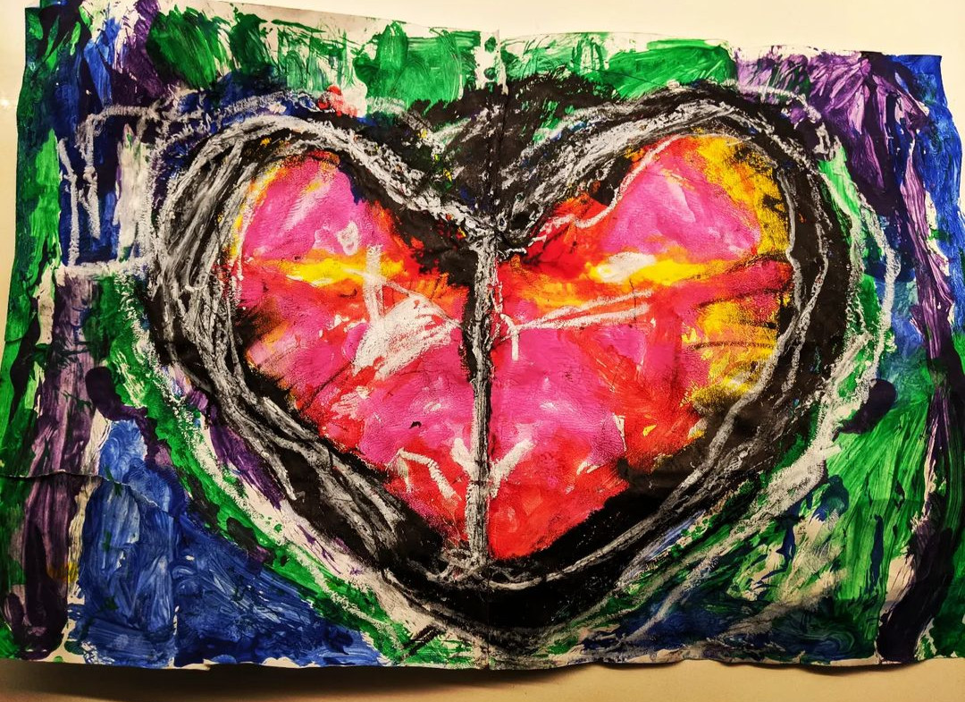 painted heart on a colorful background