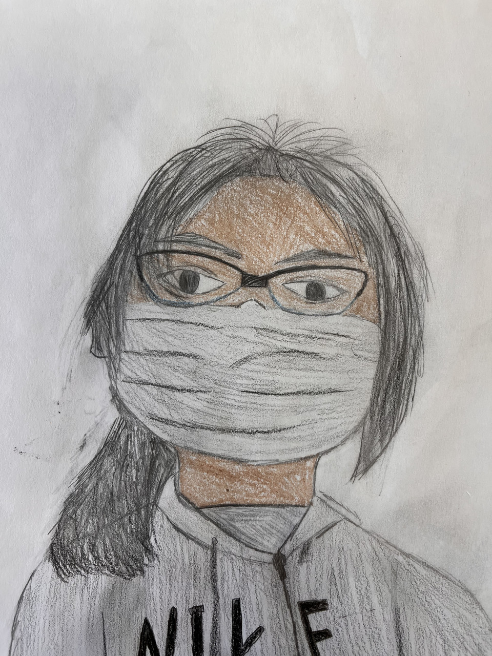Self portrait of Kimberly Quiahua done with crayon and color pencil.