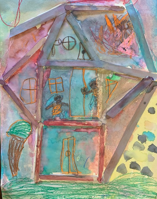 House created with craft sticks and colorful paint.