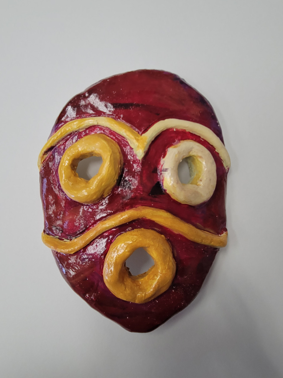 Clay sculpture of tribal mask.