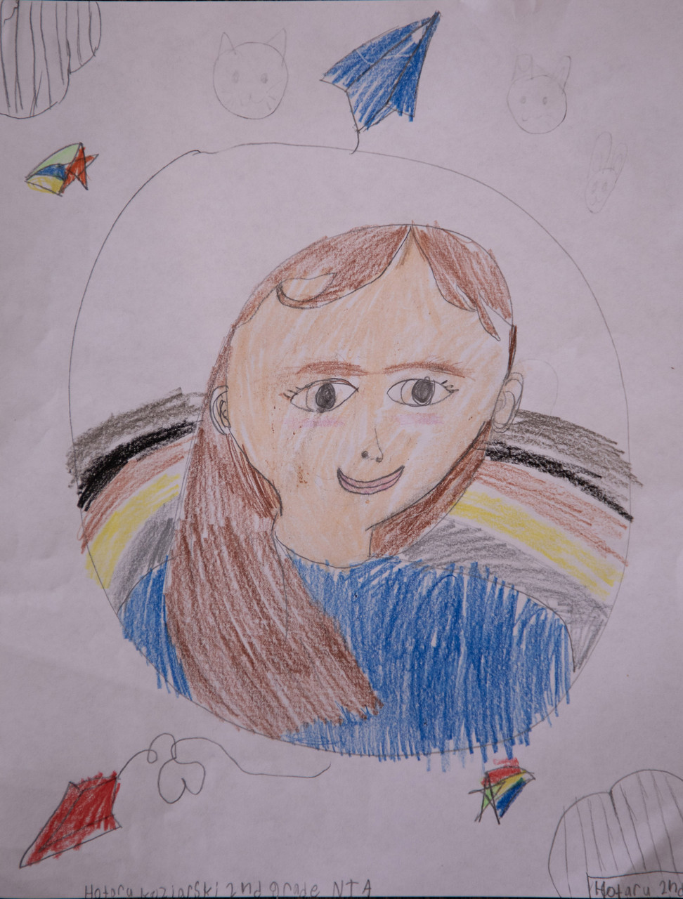 Colorful drawing of a girl and paper airplanes.
