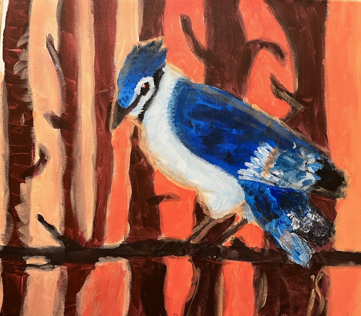 A painted blue jay sits on a brown tree branch. There is an orange and brown background behind.