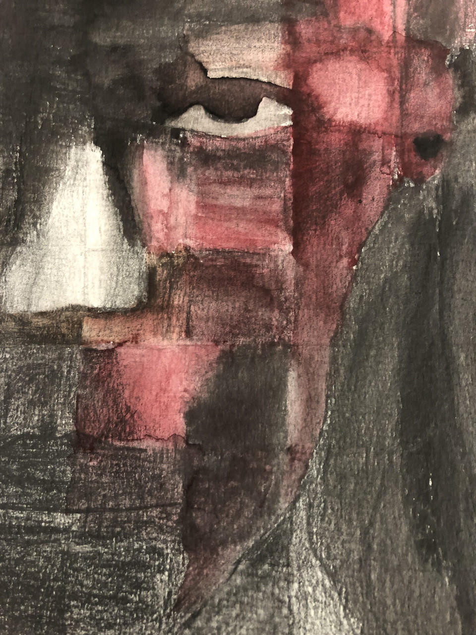 Portrait of half a face in red and black watercolor paint.