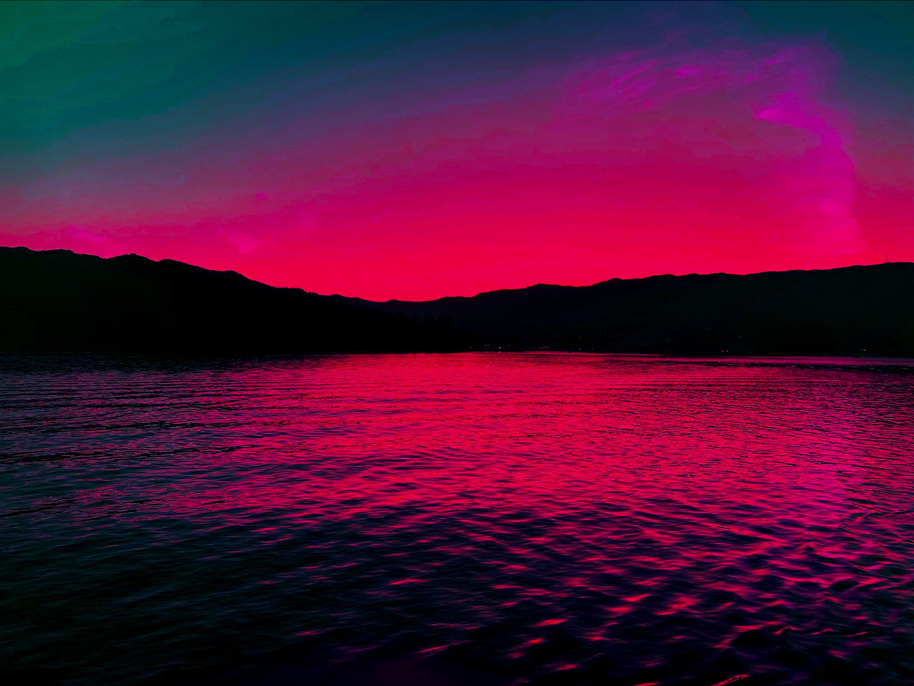 A sunset over a lake.