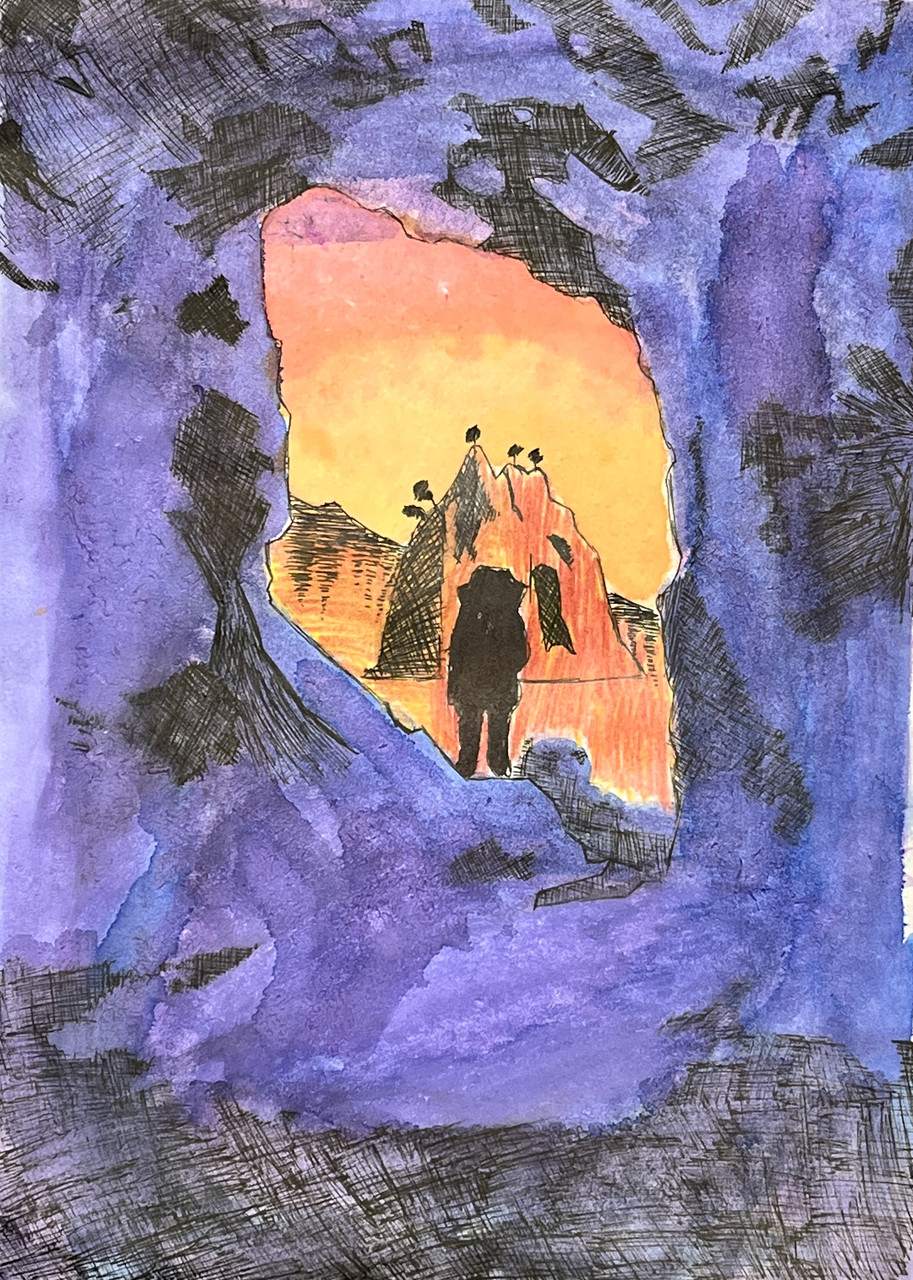 Purple rocks surround an orange sunset