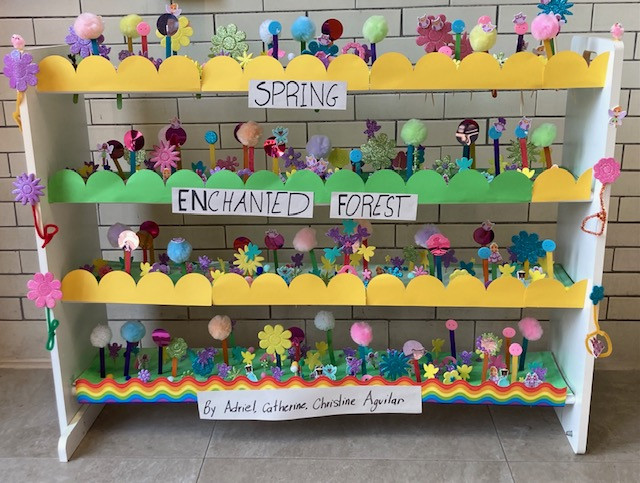 Shelf with colorful trees and decorations to represent forests.