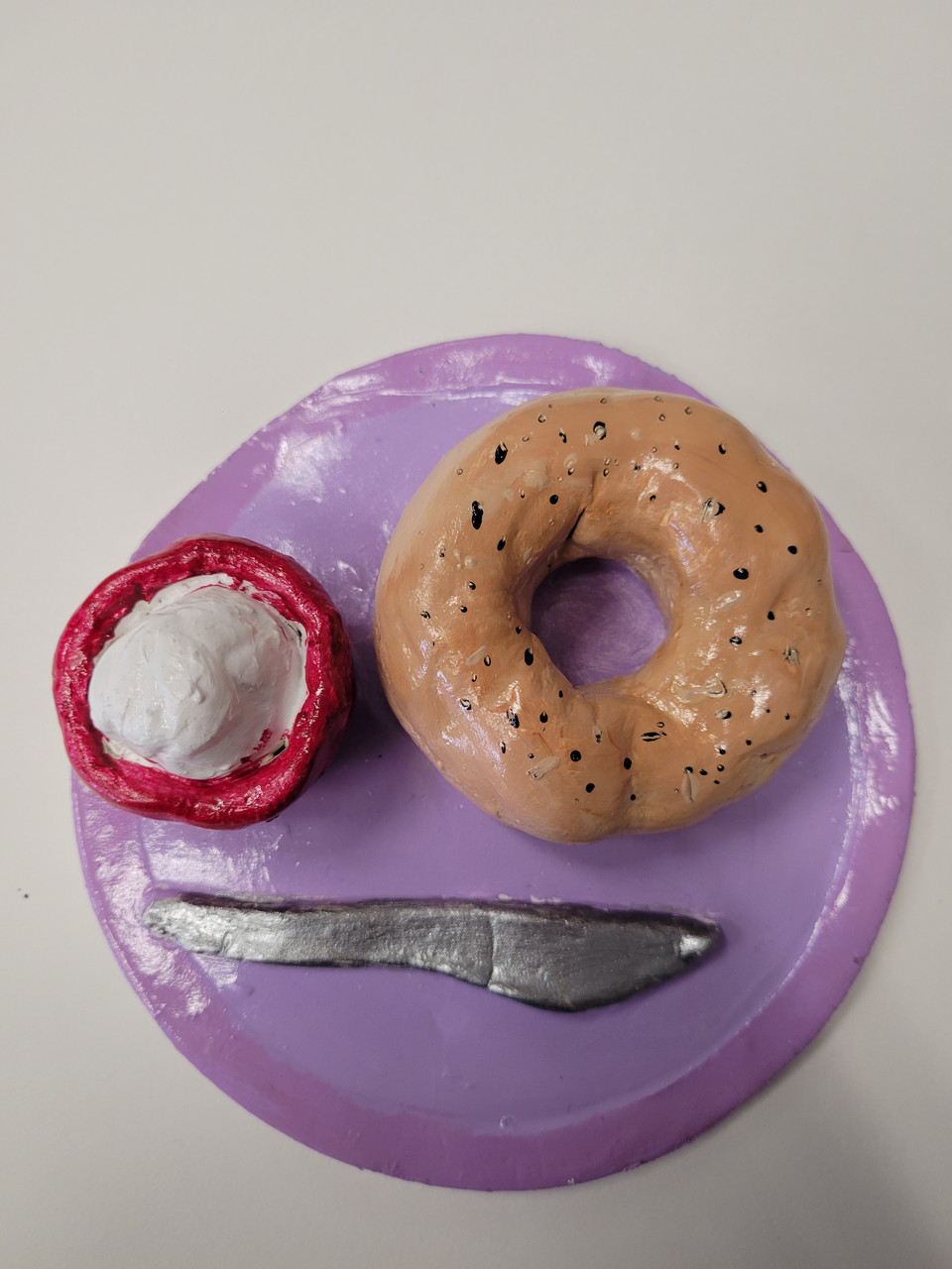 Bagel and cream cheese made of clay