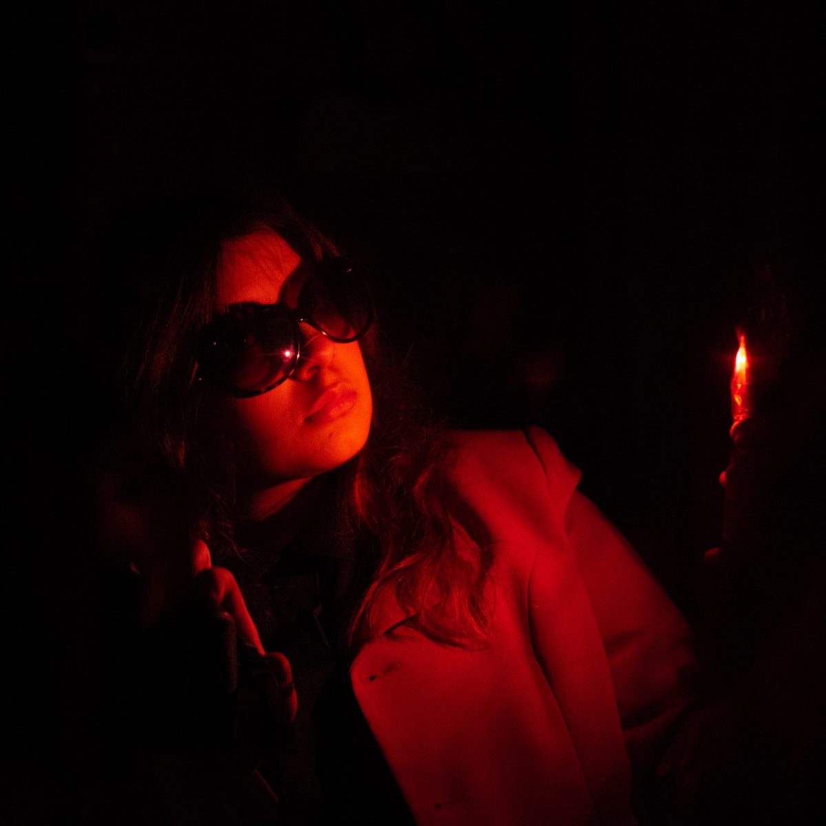 Photo with red dramatic lighting on a subject.