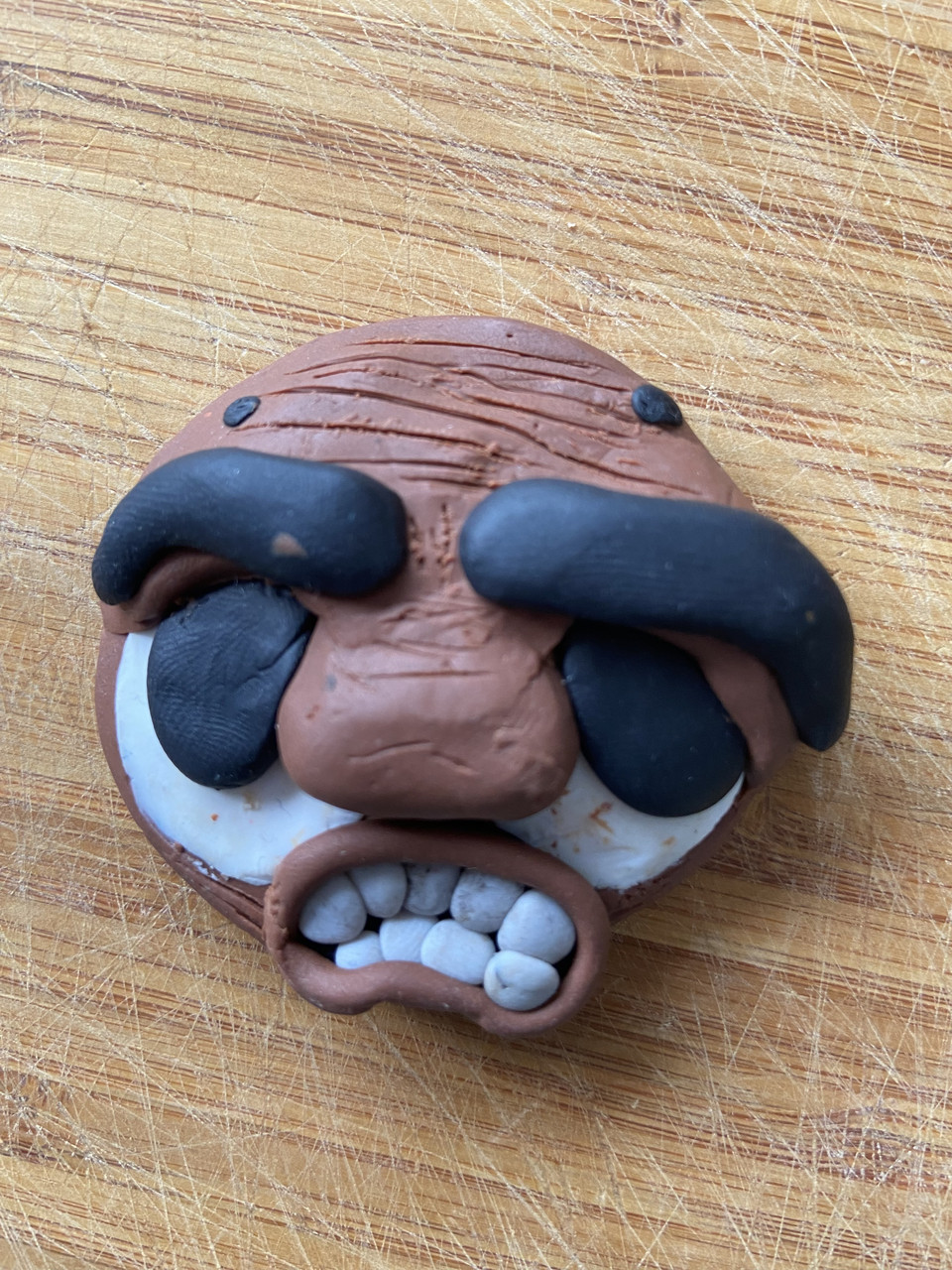 A cartoon-like face with big eyes