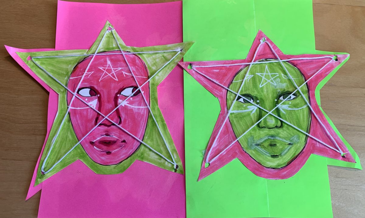 pink face and green face in stars with white string making the star on top