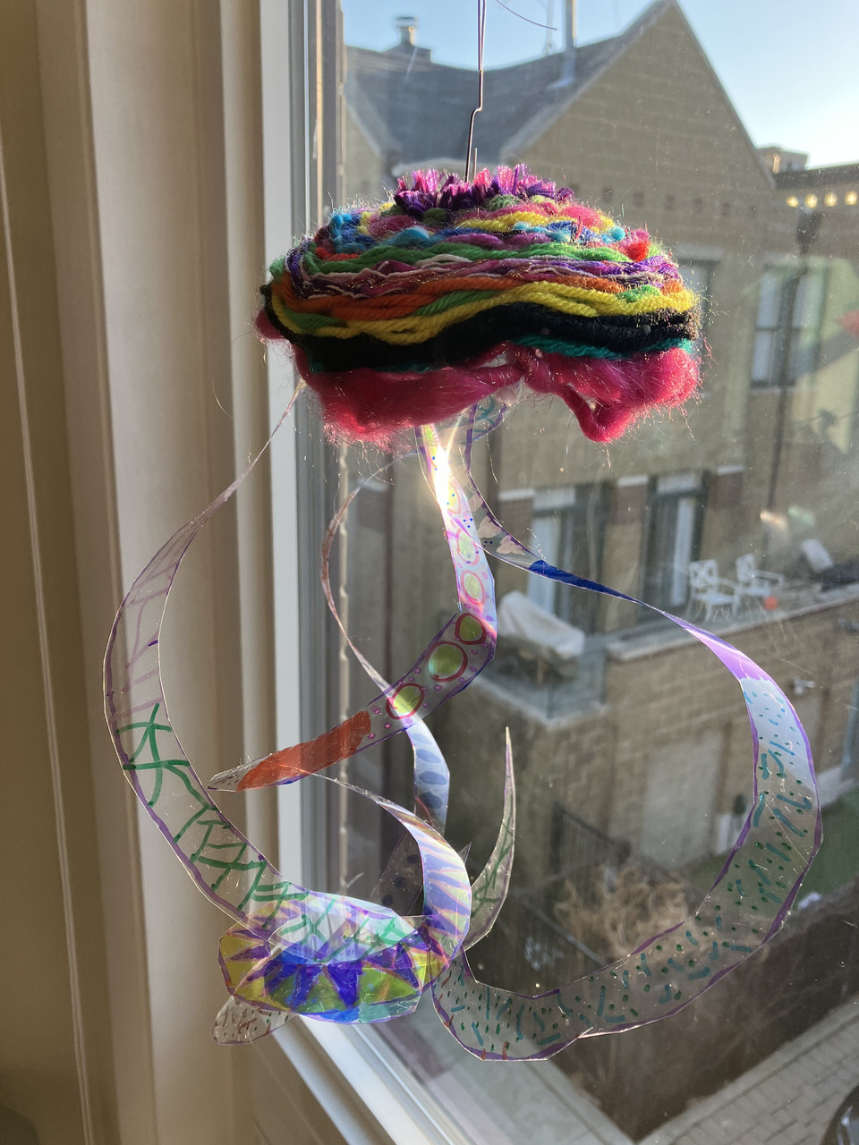 sculpture of jellyfish with yarn body.