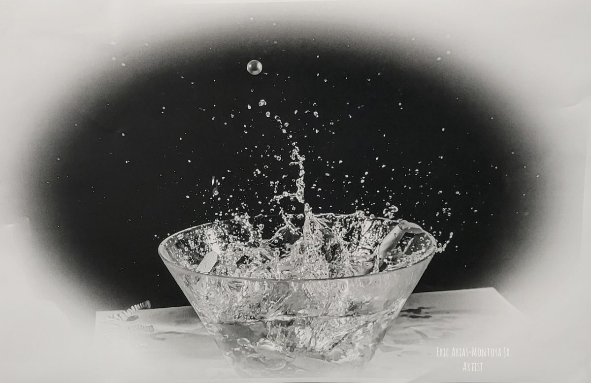 Black and white photo of water disturbed in a bowl and spilling out.