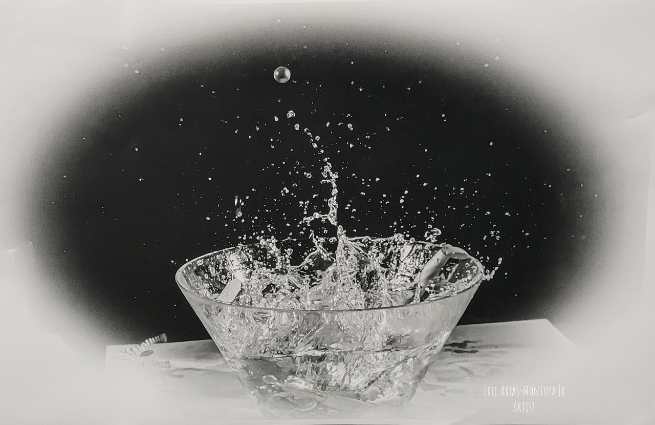 Black and white photo of water disturbed in a bowl and spilling out.