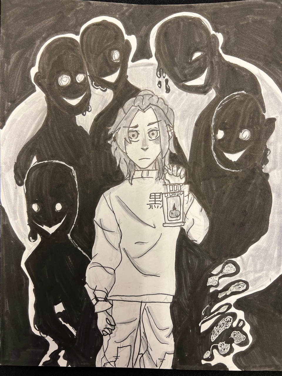 black figures surrounding a person drawn in black and white