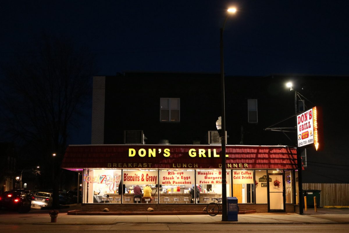 A picture of a diner on a street.