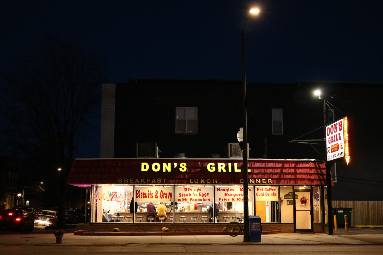 A picture of a diner on a street.