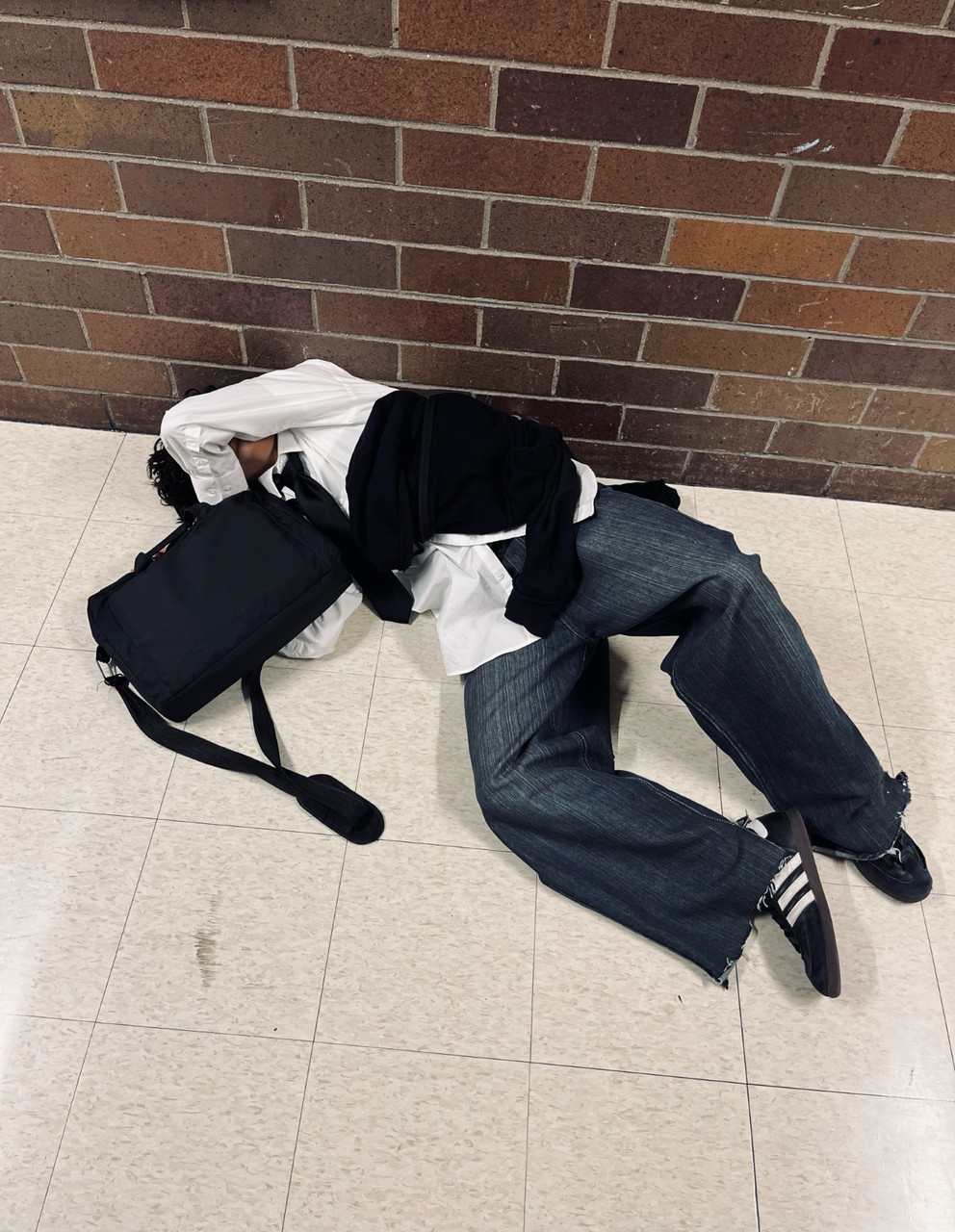 Photo of a person on a floor.