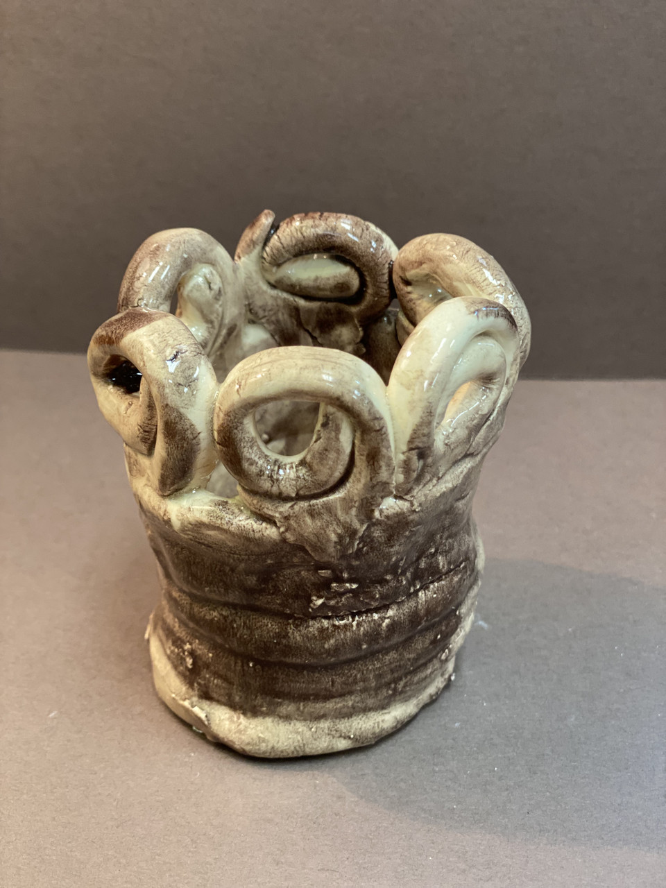 Ceramic sculpture of cinnamon swirls.