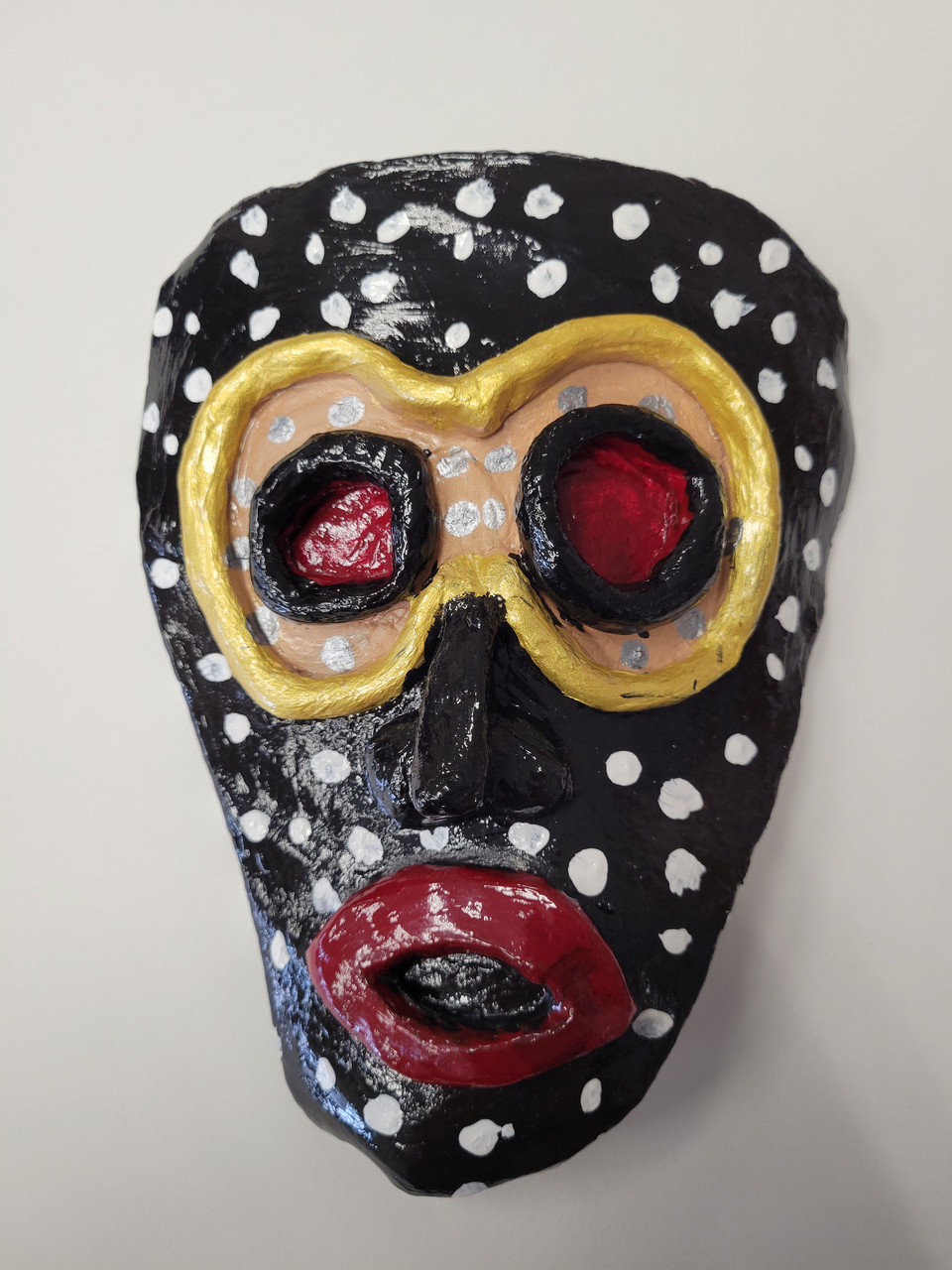 Sculpture of a tribal mask.