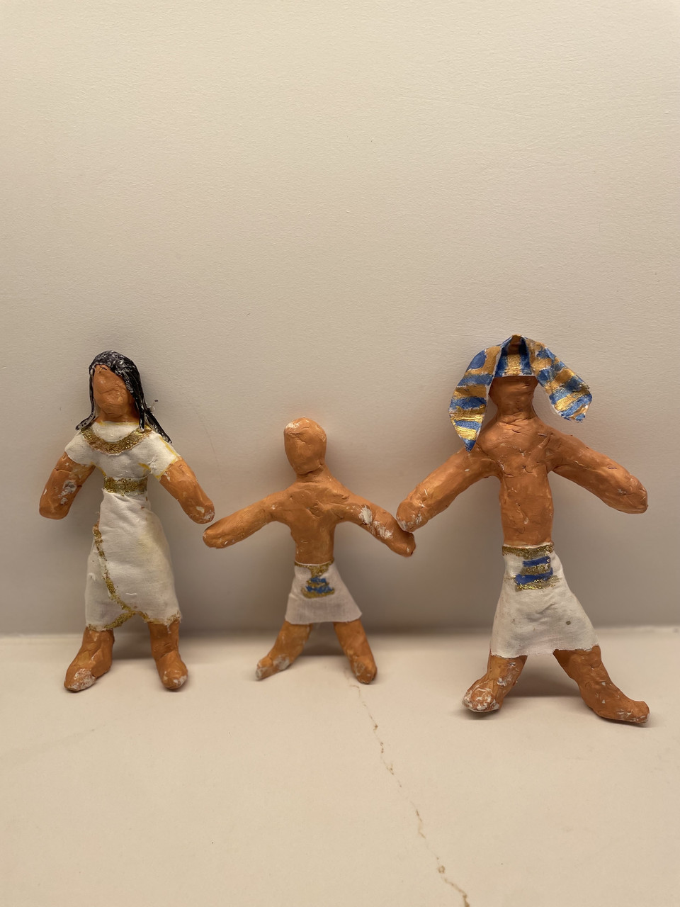 Clay modeled after 3 ancient Egyptian people.
