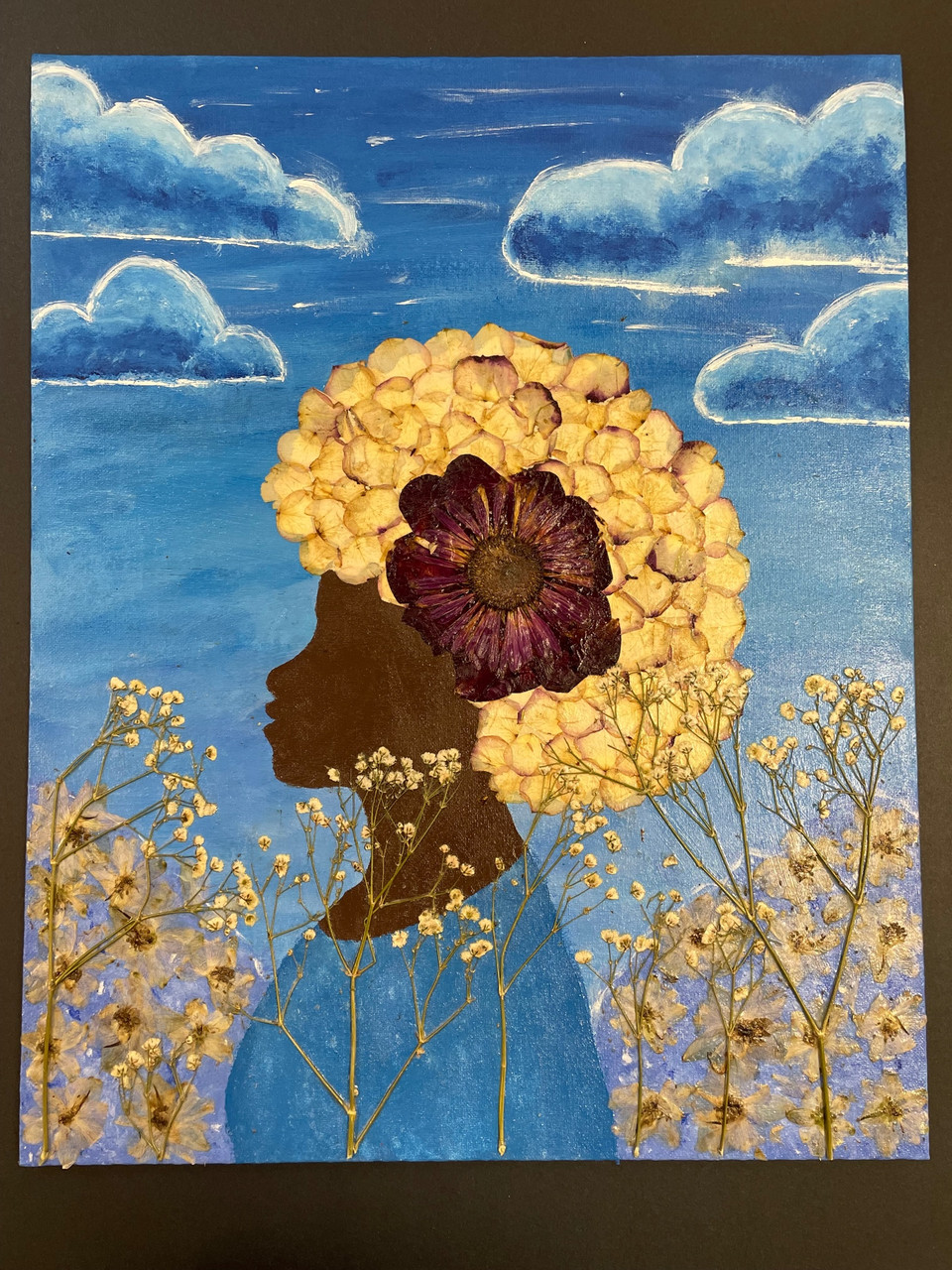 Drawing of a girl with a hair full of flowers.