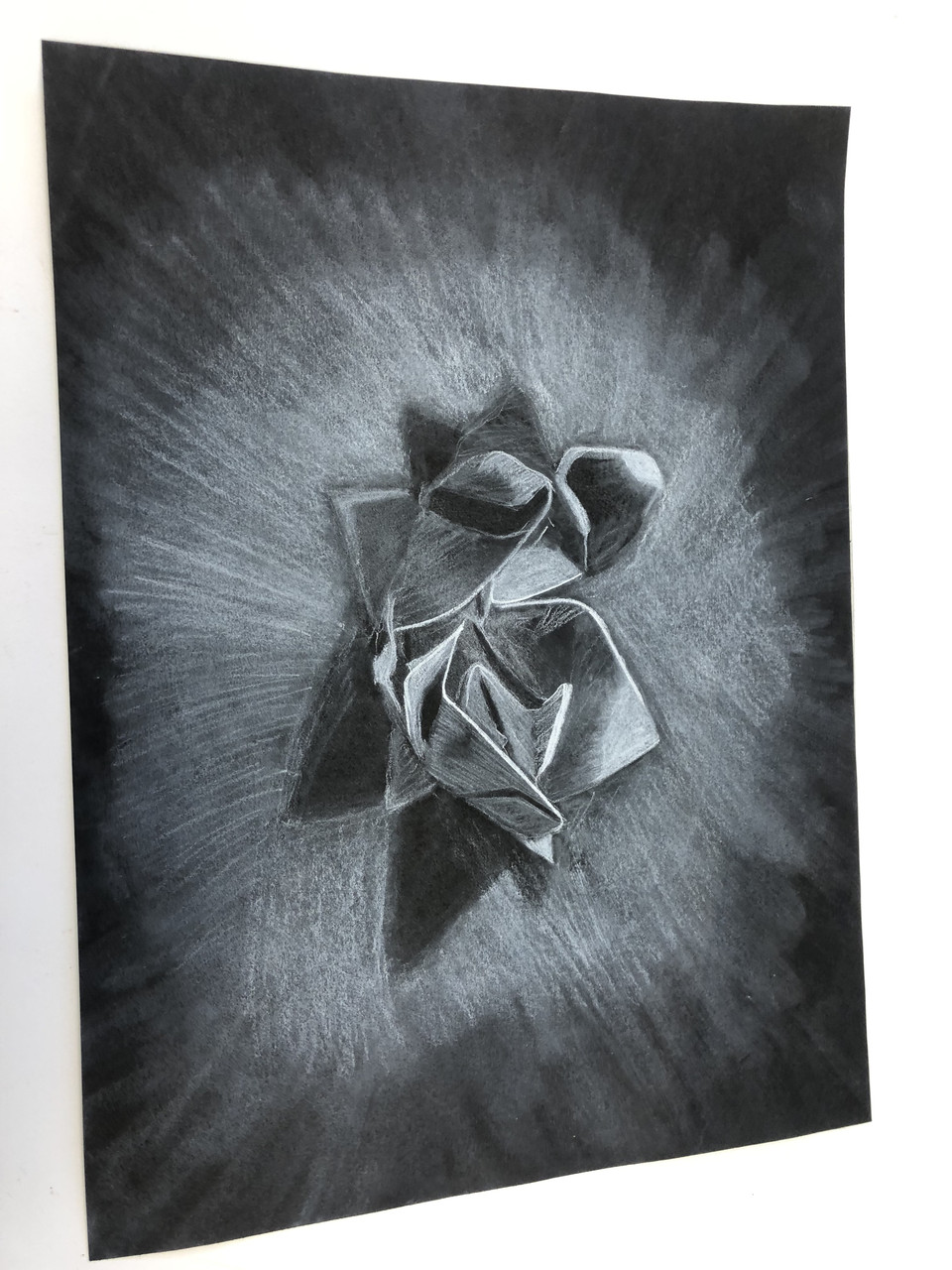 Charcoal drawing of origami.