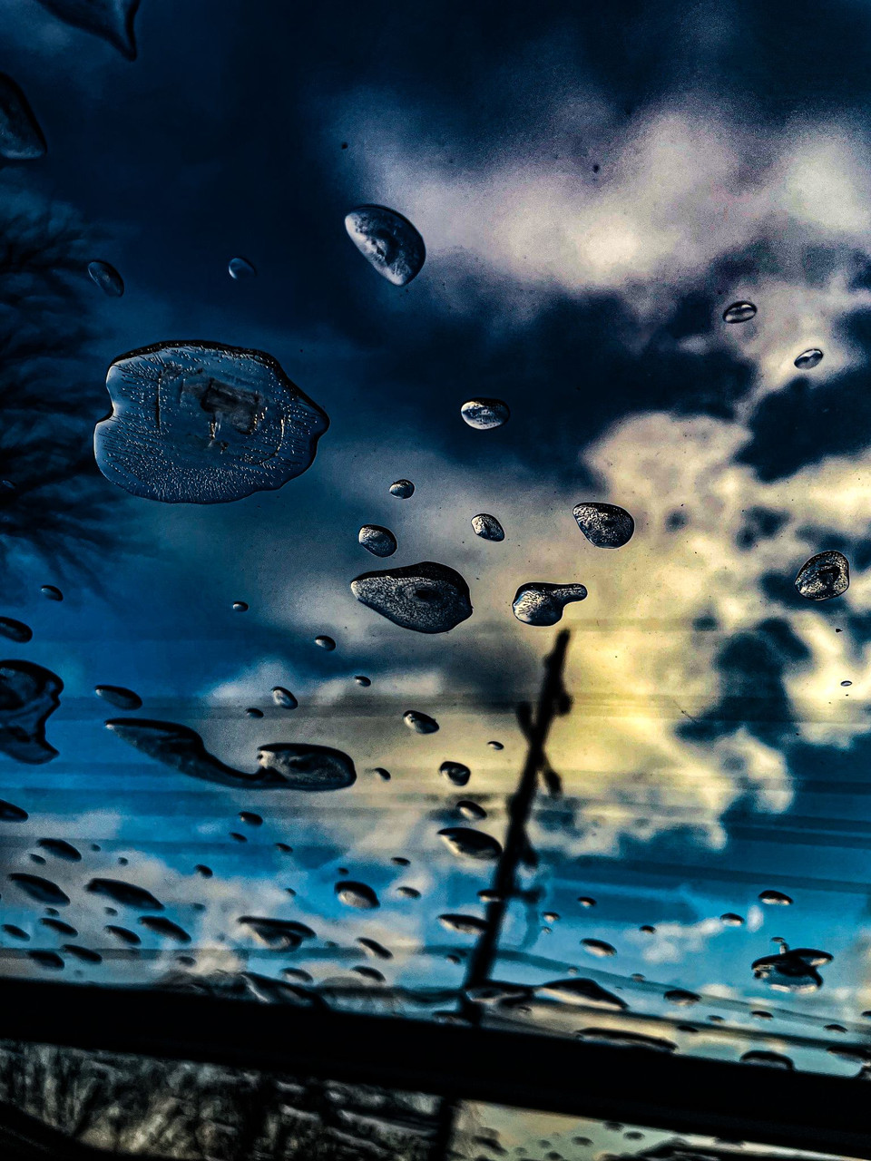 Photo of rain drops on a window.