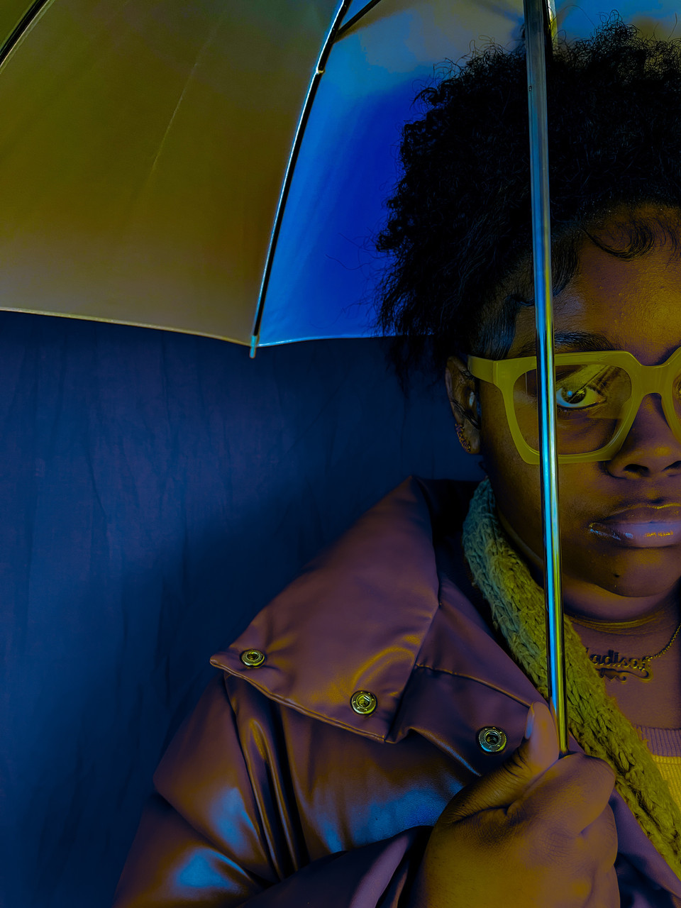 Photo of a person holding an umbrella.