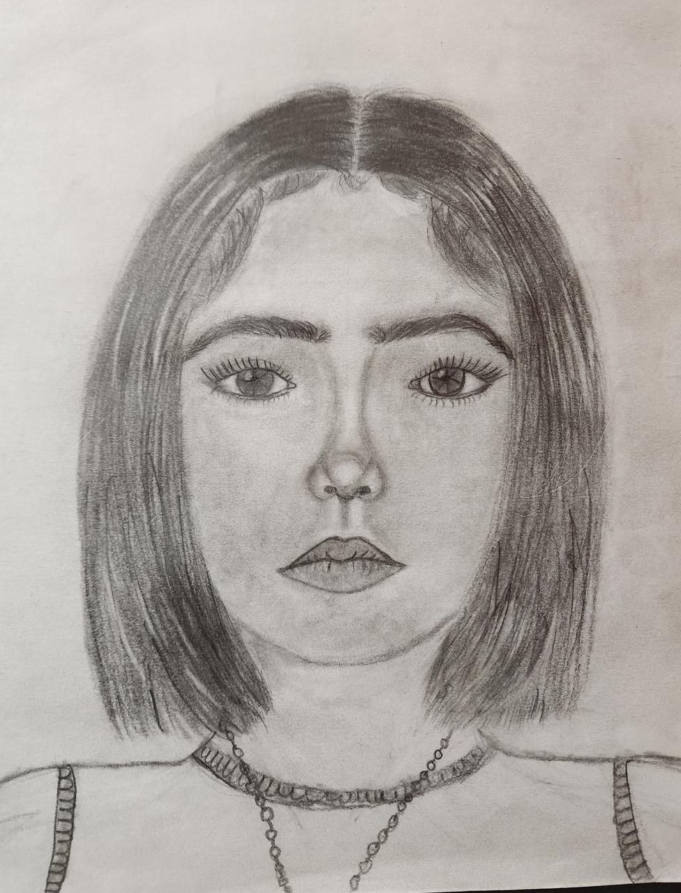 A self portrait graphite drawing of a person with shoulder length hair parted int he middle and a necklace on.