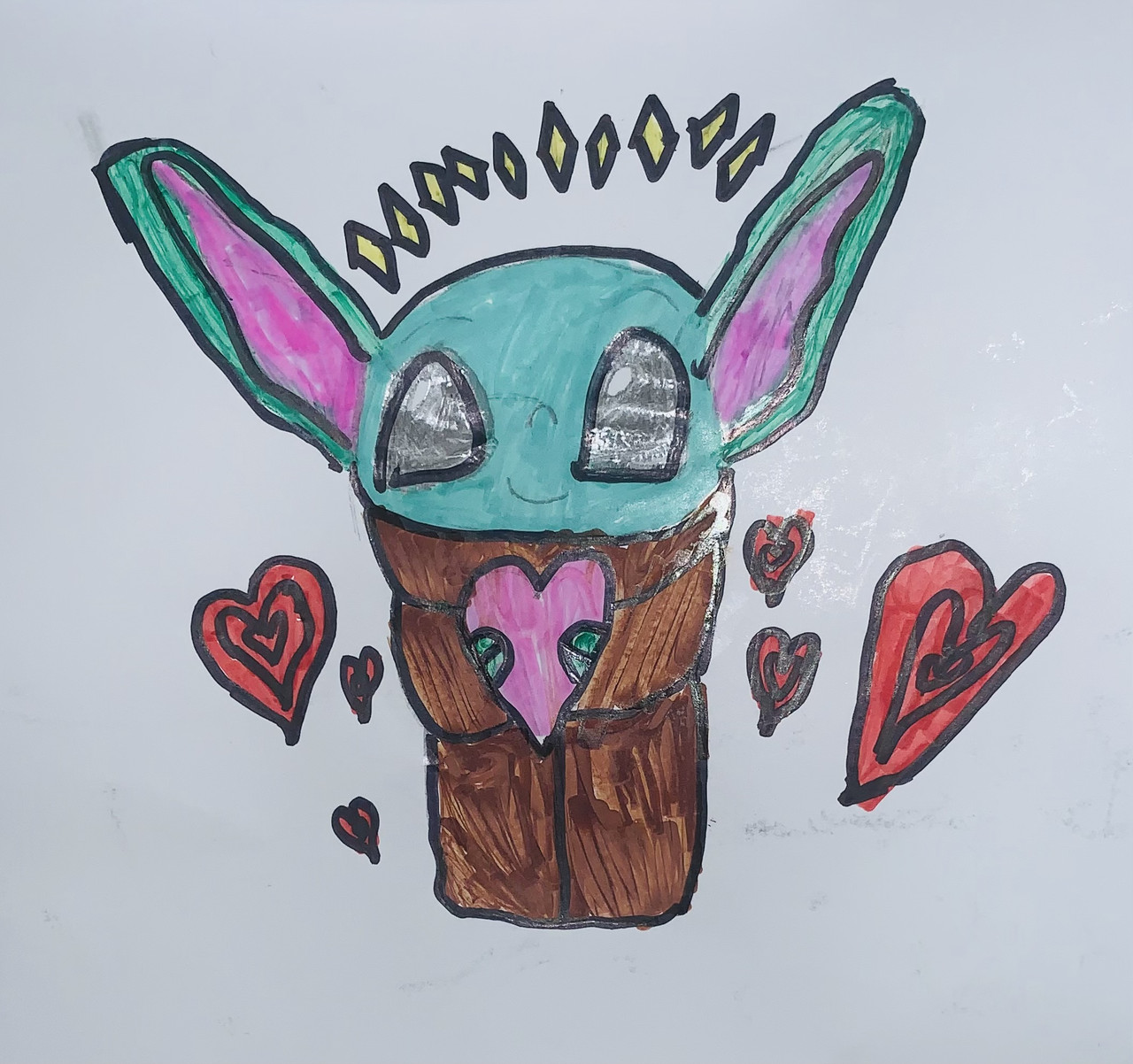 Drawing of baby yoda holding a pink heart with multiple red hearts beside him. Diamonds are drawn above him.