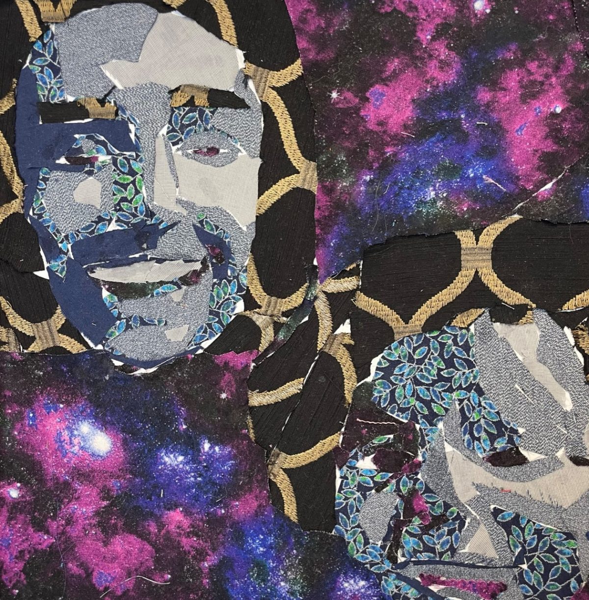 A fabric on board piece with 2 blue floating faces with a galaxy in the background.