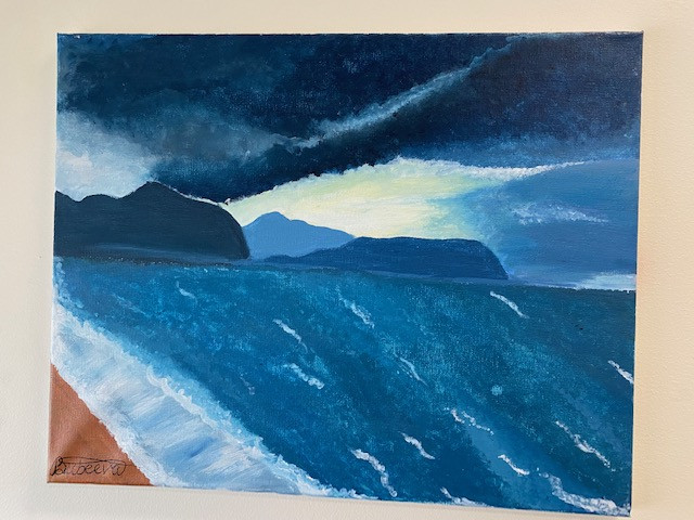 An acrylic painting of a storm moving in over a beach and mountains.