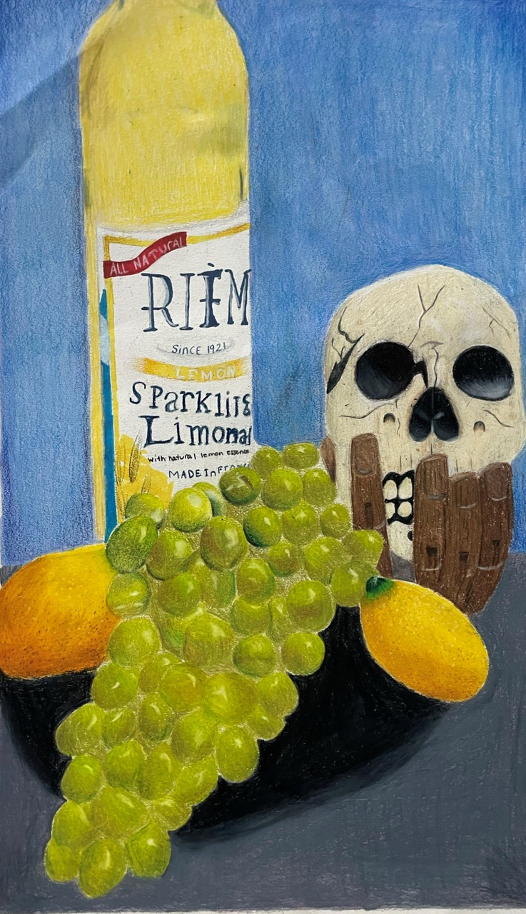A colored pencil on paper still life. There is a blue background and grey table. On top of the table are green grapes, lemons, a skull and a bottle of sparkling lemon juice.