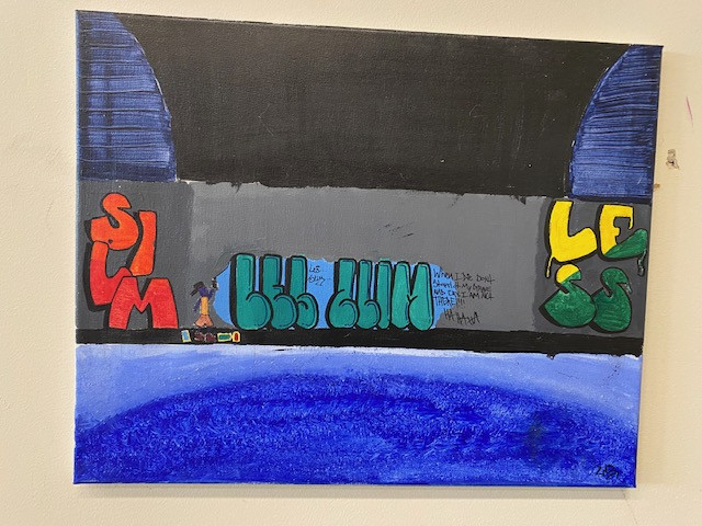 An acrylic painting of graffiti on a gray wall.