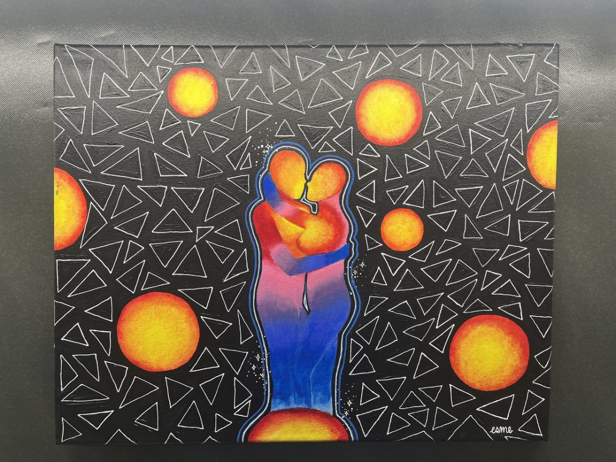 A painting of two body figures at the center hugging each other closely. Surrounding them is a white triangle pattern on a black background. The background has circles that are painted red and yellow.
