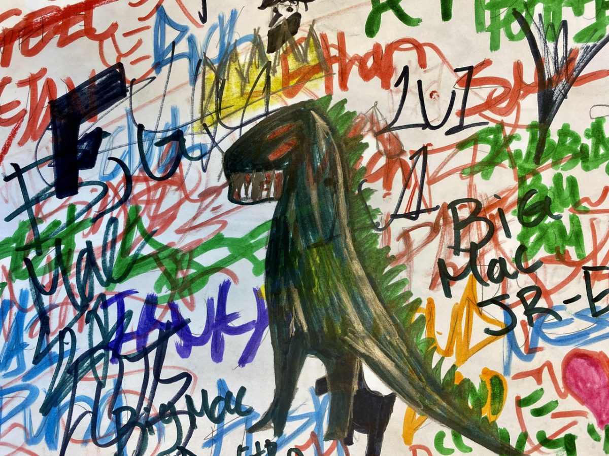 Marker drawing of T-Rex with lots of scribbled colors around it.