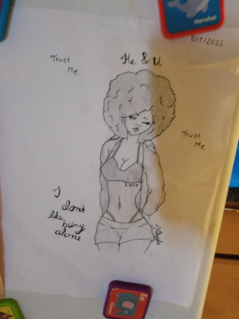 A drawing of a girl with curly hair.